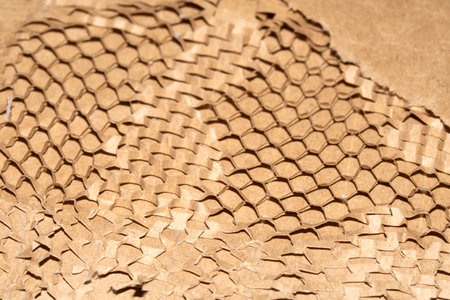 Cardboard Paper Screwed Crunched up Box Packaging with Honeycomb Pattern Close up for Backgroundの写真素材