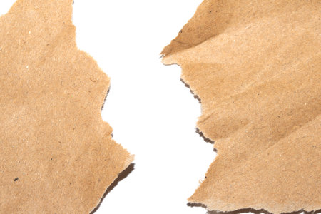 Ripped and Torn Jagged Paper Card Background in Brownの写真素材