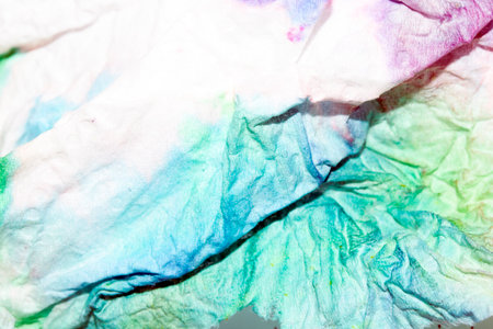 Paper Screwed Up Tissue With Pastel Watercolor Paints in Multicolour Rainbow For Backgroundの写真素材