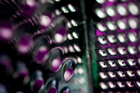Close Up of a Steel Metal Perforated Hole Background Abstract Futuristic Circlesの写真素材