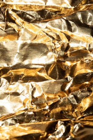 Jagged Crumpled and Creased Gold Shiny Metal Metallic Background