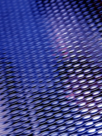 Close Up of a Steel Metal Perforated Hole Background Abstract Futuristic Circles