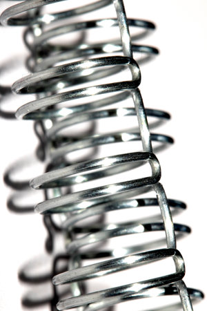 Abstract Close up of Metal Coil Spring Spiral Industrial Blue Background