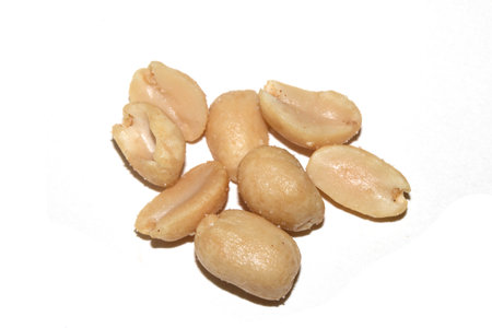 Close up of roasted peanuts on a White Background