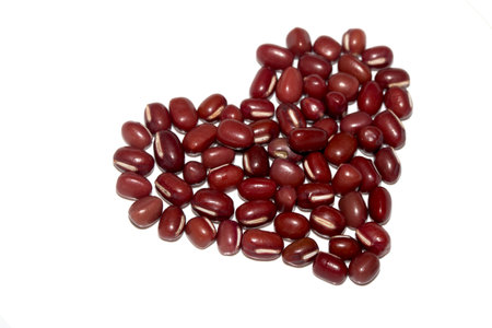 Close Up of Dried Beans Red Red Adzuki Mung  In a Heart Shape on a White Background