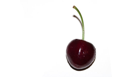 Close up of a cherry fruit on white background