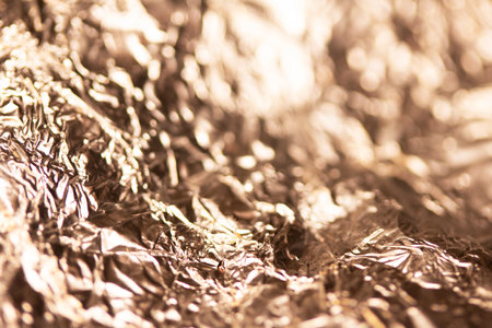 A Shiny Foil Crumpled in Sharp Crumpled Metallic Gloss Background  Goldの写真素材