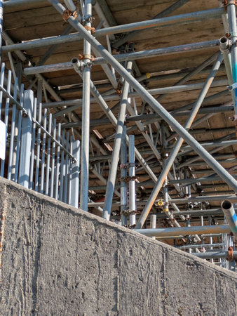 Large Industrial Building Covered and Surrounded with Scaffoldingの写真素材