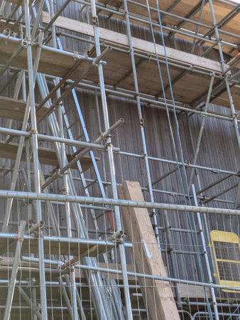 Large Industrial Building Covered and Surrounded with Scaffolding