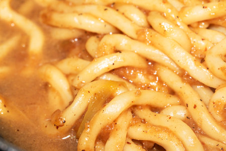Close Up of Spicy Udon Noodles in Sauce