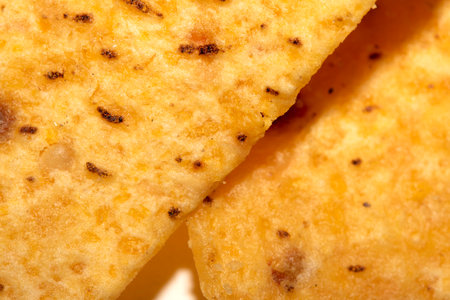 Close Up of Nacho Corn Crisp Chip Triangle Shape Snack