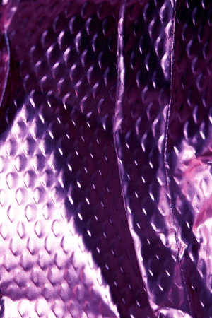 Industrial foil shiny background with rivets and crumpled linesの写真素材