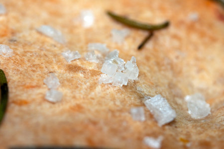 Close up of freshly baked focaccia bread  with salt and rosemaryの写真素材
