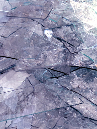 Close up od smashed glass abstract background splintered shards