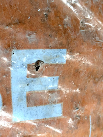 Written Wording in Distressed State Typography Found Ransom Letter E