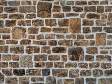 Old church wall with random handmade bricks and masonary old surfaceの写真素材