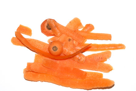 Close up of carrot scrap peelings food waste for compost on white backgroundの写真素材