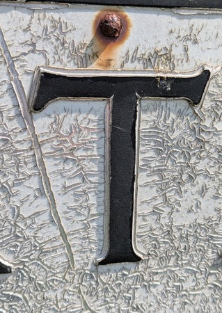 Written Wording in Distressed State Typography Found Ransom Letter T