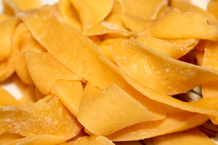 CLose up of freshly made raw tagliatelle pasta