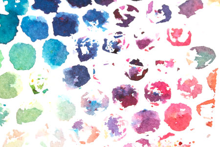 Vibrant Explosion of Multicolour Rainbow Watercolour Paint Splatters and Circles Spots on White Backgroundの写真素材