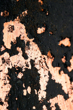 Close up of heavy black rust on a brass base abstract background