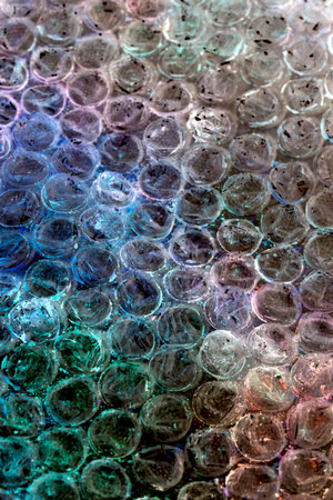 Absract background of shiny plastic and bubbles dreating bright sci-fi style texture backgroundの写真素材