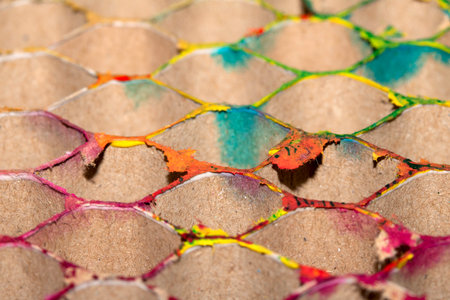 Close up of packing cardboard that has been used with paint to make an abstract background reusedの写真素材