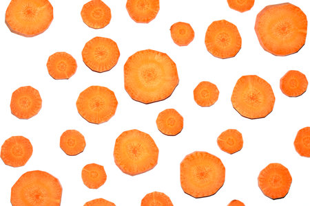 Chopped Sliced Orange Carrot Vegetable Pieces on White Backgroundの写真素材