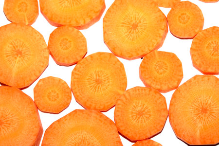 Chopped Sliced Orange Carrot Vegetable Pieces on White Background