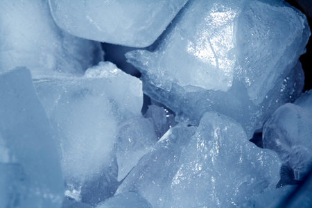 Close up of abstract blue ice cubes frozen background
