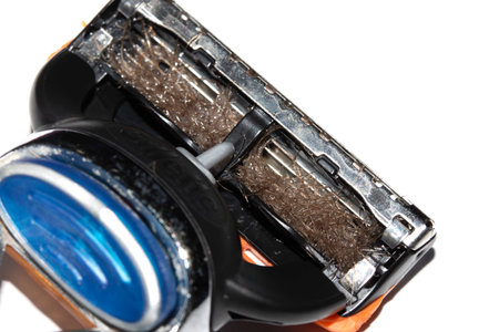 Close up of a used shaving razor on white backgroundの写真素材