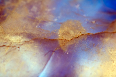 Beautiful close up of quartz crystal rock shard with reflective rainbow spiritual light