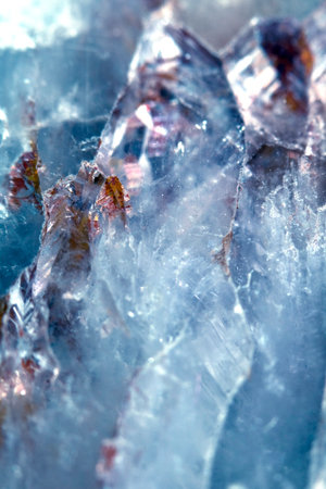 Beautiful close up of quartz crystal rock shard with reflective rainbow spiritual lightの写真素材