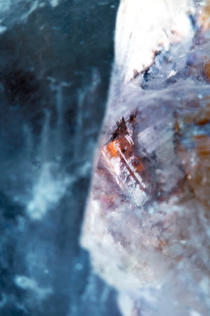 Beautiful close up of quartz crystal rock shard with reflective rainbow spiritual light