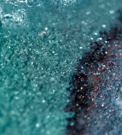 Beautiful close up of quartz crystal rock shard with reflective rainbow spiritual lightの写真素材