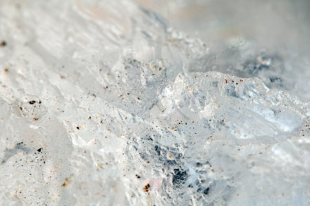 Beautiful close up of quartz crystal rock shard with reflective rainbow spiritual light