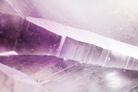 Beautiful close up of quartz crystal rock shard with reflective rainbow spiritual lightの写真素材