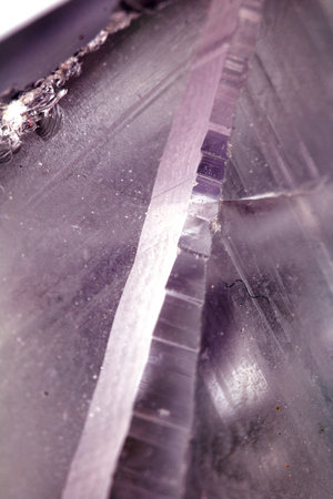 Beautiful close up of quartz crystal rock shard with reflective rainbow spiritual light