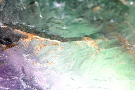 Beautiful close up of quartz crystal rock shard with reflective rainbow spiritual light