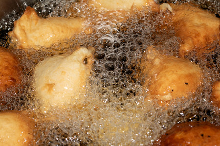 Close up of frying batter in oil chicken balls home made