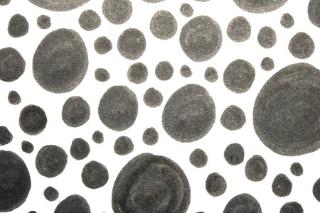 Close up of hand drawn doodle pen circle spirals and spots and dots on white background
