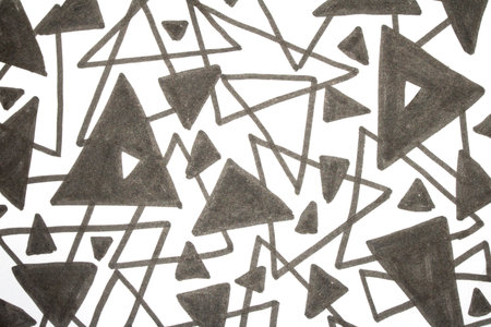 Close up of hand drawn doodle pen triangle square black lines and waves on white background