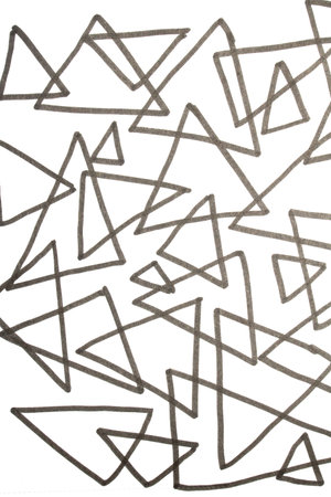 Close up of hand drawn doodle pen triangle square black lines and waves on white background