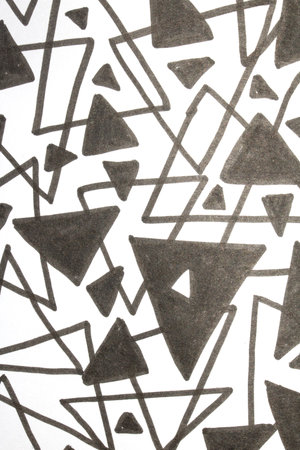 Close up of hand drawn doodle pen triangle square black lines and waves on white background