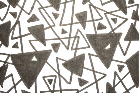 Close up of hand drawn doodle pen triangle square black lines and waves on white background