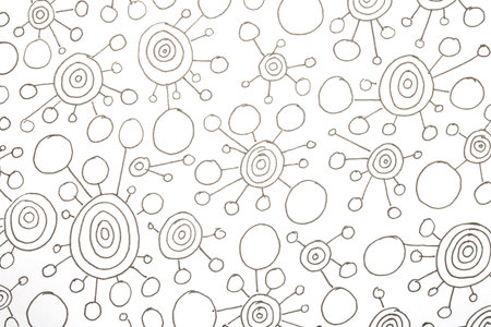 Close up of hand drawn doodle pen circle spirals and spots and dots on white background