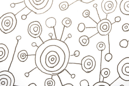 Close up of hand drawn doodle pen circle spirals and spots and dots on white background