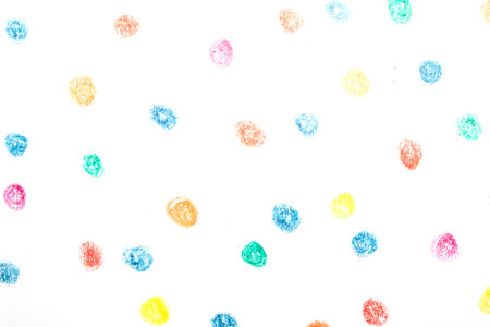 Multicoloured children's pencil crayon spotty polka dots background