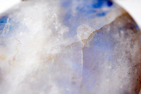 Beautiful close up of quartz crystal rock shard with reflective rainbow spiritual lightの写真素材