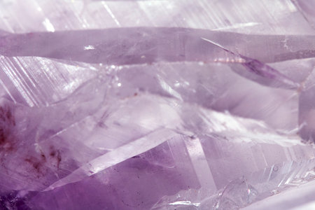 Beautiful close up of quartz crystal rock shard with reflective rainbow spiritual light